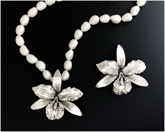 Cattleya pin and pearl necklace